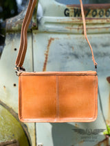 Image of the back of the Yipee Kiyay Claire crossbody purse. Solid veggie tan leather.